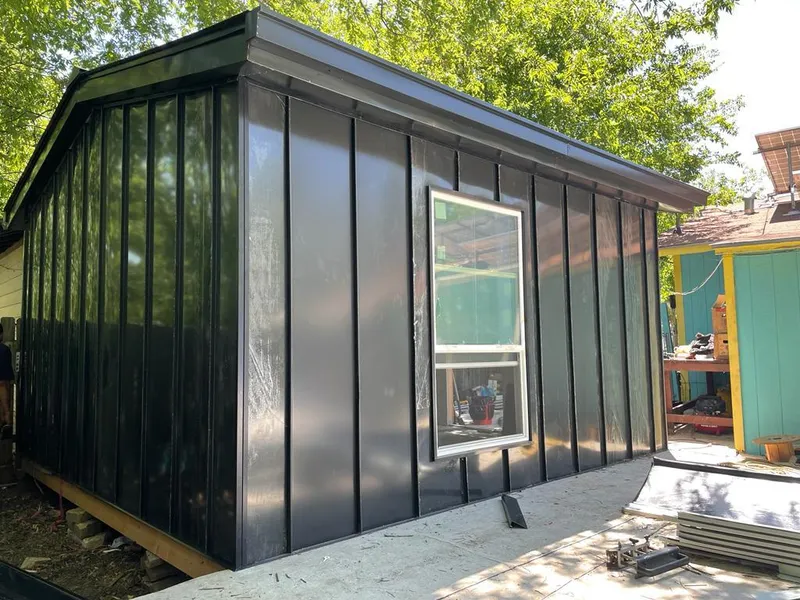 Black standing seam metal wall panels for Roof Inspection in Willowbrook